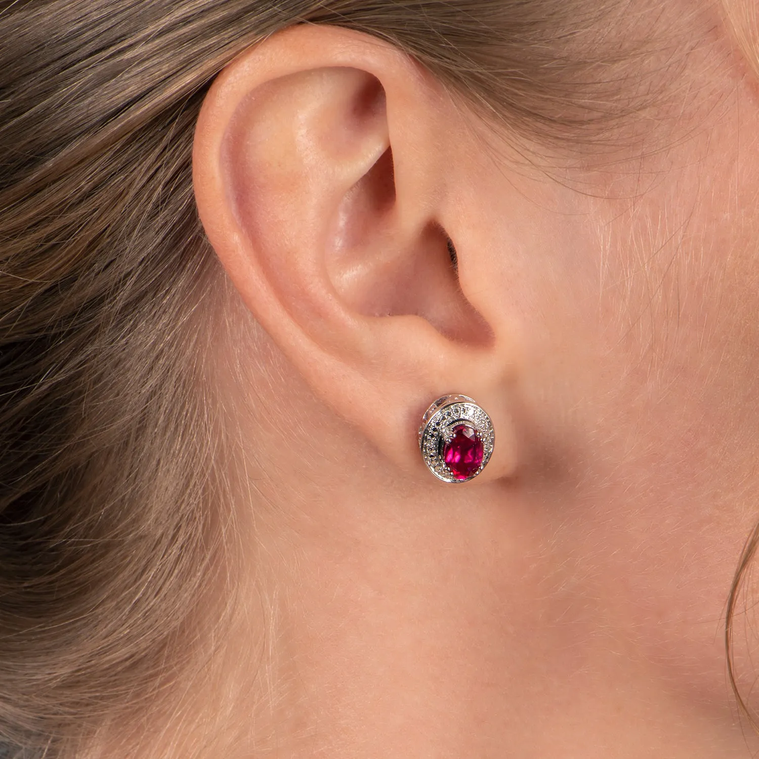 Jewelili Sterling Silver with Oval Shape Created Ruby and Natural White Round Diamonds Stud Earrings